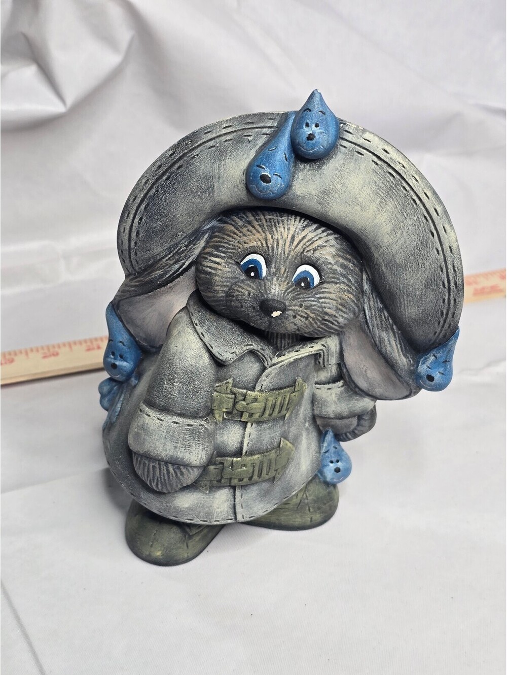 Vintage Ceramic Figurine of a Character in a Large Hat with Blue Water Droplets